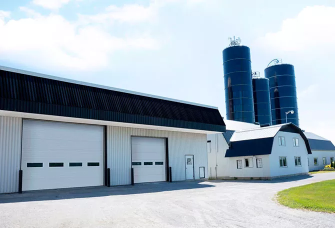 Durable and functional agricultural garage doors in Moka Brown by Garaga, designed for tough conditions and seamless access